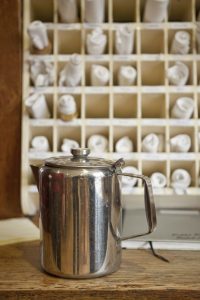 Kettle in front of napkin holder